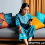 증강 현실을 통한 혁신적 소비 경험 - A young Malay woman using an augmented reality (AR) app on her smartphone to virtually try on modern...